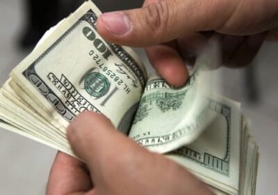 an-employee-counts-a-stack-of-u-s-one-hundred-dollar-bills-inside-a-currency-exchange-center-in-mexgse